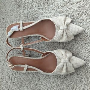 ASOS DESIGN Wide Fit Suzy bow slingback mid heeled shoes in naturalNow